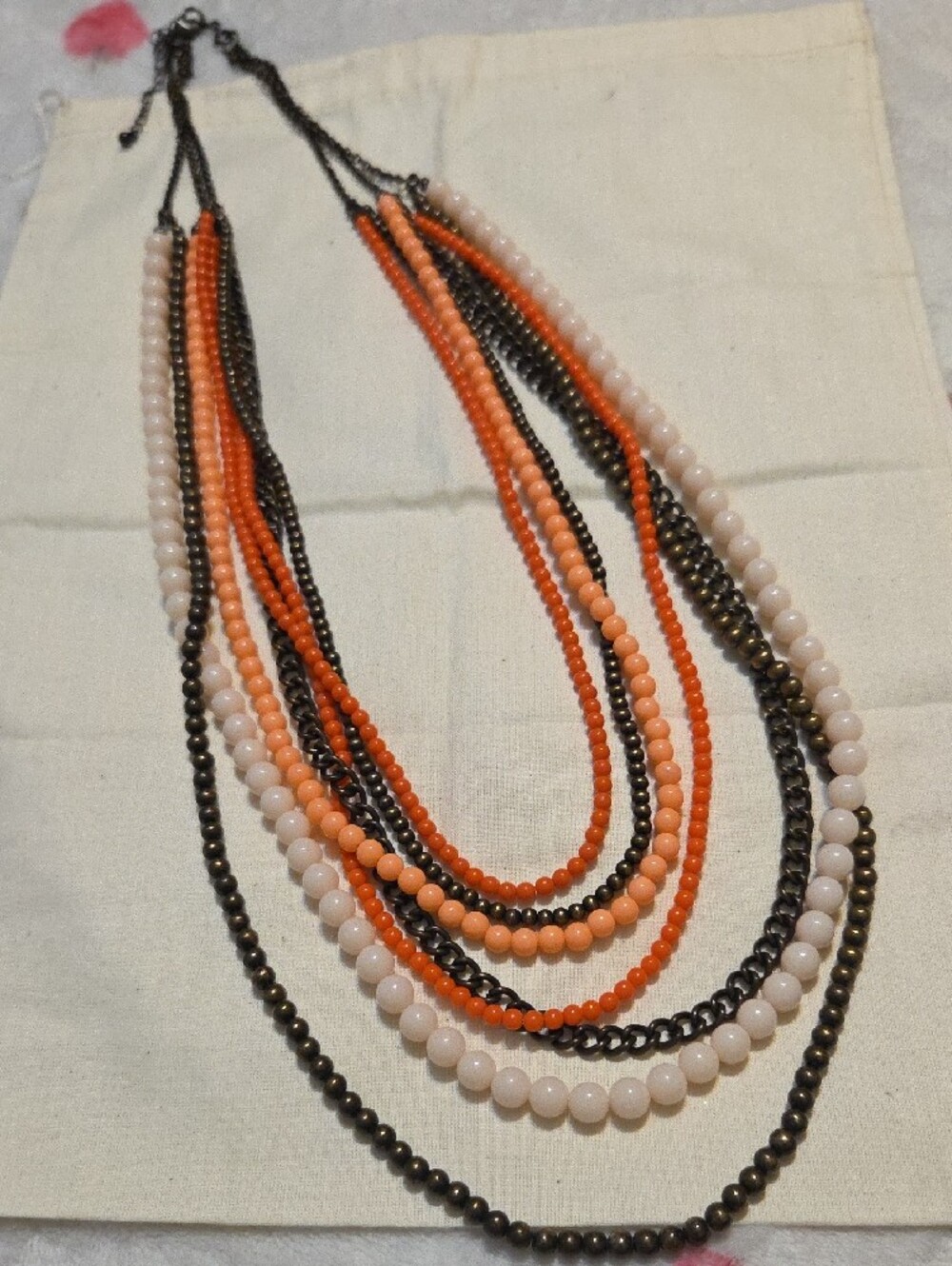 Premier Layered Bead Necklace in Orange and Cream with Bronze Chains